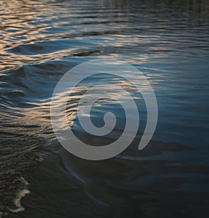 Abstract blurred nature background, river water surface and ripples