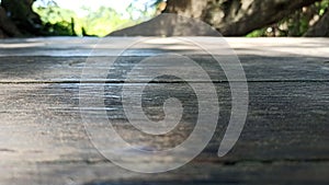 Abstract blurred old wood table and viewâ€‹natureâ€‹ for background texture