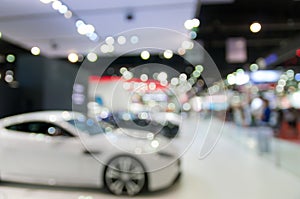 Abstract blurred photo of motor show, car show room