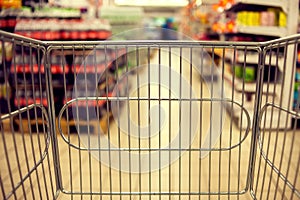 Abstract blurred photo of store with food trolley at a supermarket