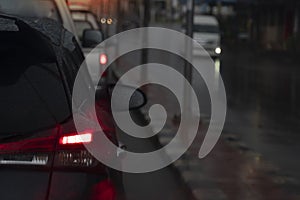 Abstract and blurred of rear side cars on the road during the rainy season.