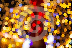 Abstract blurred of red and gold glittering shine bulbs lights background, blur of Christmas wallpaper decorations