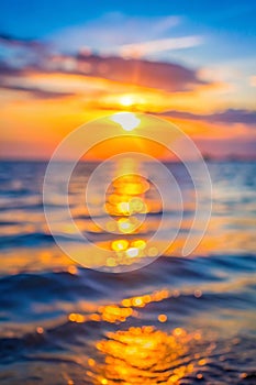 Abstract blurred sunset of sea background with flare light at twilight time concept photo
