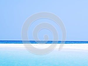 Abstract blurred on vacation summer ocean beach background. Clear blue sky, beautiful tropical sea, blue water and nice beach