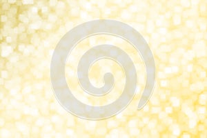 Abstract blurred yellow gold square bokeh background .