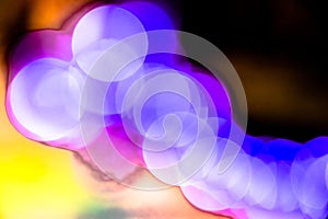 Abstract blurry colorful bokeh light circles glowing, close up