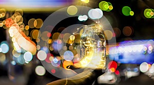 Abstract bokeh of festive lights through a glass jar at twilight