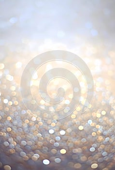Abstract bokeh light background. Christmas or New Year background. Sparkled glitter in soft light, Silvery white photo
