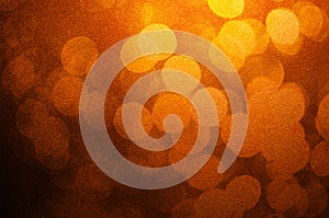 Abstract bokeh light brown and yellow colors defocused circular summer background. Christmas light or season greeting background.