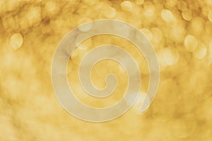 Abstract bokeh light on golden elegant background