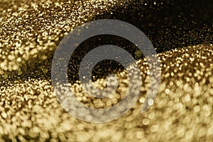 Abstract bokeh light on golden elegant background