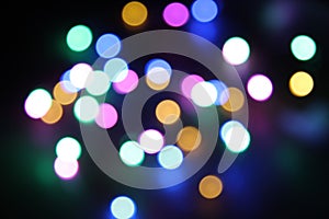 Abstract bokeh nigth background. Colorful magic lights background, decoration for the party. Neon light glowing effect. Glow
