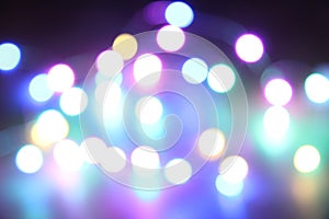 Abstract bokeh nigth background. Colorful magic lights background, decoration for the party. Neon light glowing effect