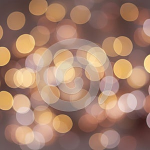 Abstract bokeh pattern featuring overlapping circular light spots in warm tones of