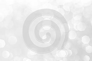 Abstract bokeh white,light grey,sliver colors de focused circular background.Night light season greeting elegance backdrop or artw