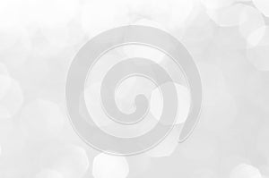 Abstract bokeh white,light grey,sliver colors de focused circular background.Night light season greeting elegance backdrop or artw