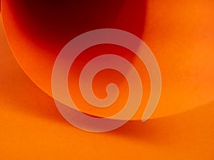 Abstract bright orange paper background for your design. Three-dimensional geometric image. Selected sharpness