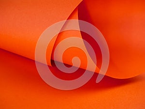 Abstract bright orange paper background for your design. Three-dimensional geometric image. Selected sharpness