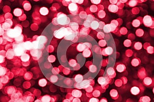 Abstract bright red blurred bokeh background close up, defocused round pink and white lights texture, shiny glowing pattern