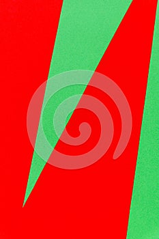 Abstract bright red on green paper background.