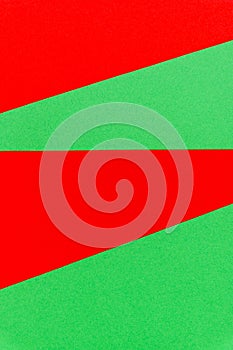 Abstract bright red on green paper vertical background.