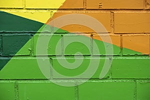 Abstract bright street colorful drawing detail of brick wall, like as graffiti closeup. Can be useful for backgrounds