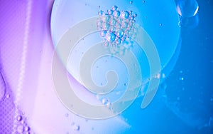 Abstract bubbles floating background. Liquid blue abstract backdrop. Flowing colorful abstract rounds texture