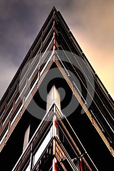 Abstract building pictured in the shape of a triangle.