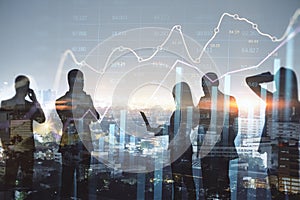 Abstract businesspeople silhouettes working together on dark city skyline wallpaper with glowing forex chart hologram. Teamwork,