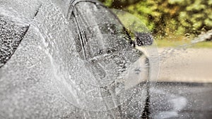 Abstract carwash background - only drops in focus. Car being was