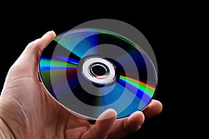 Abstract cd dvd blue-ray disk in hand