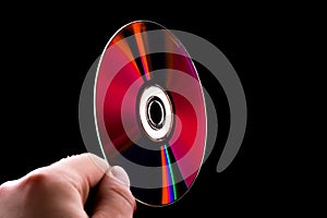 Abstract cd dvd blue-ray disk in hand