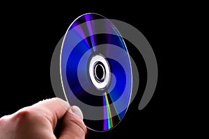 Abstract cd dvd blue-ray disk in hand
