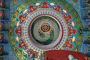 Abstract ceiling design inside the architecture of chinese style temple in Wat Borom Racha Kanchana Phi Sek Anuson