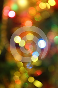 Abstract christmas background with christmas tree with decorations, defocused bokeh lights