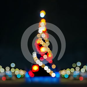 Abstract christmas background with christmas tree with decorations, defocused bokeh lights