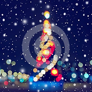 Abstract christmas background with christmas tree with decorations, defocused bokeh lights outdoors