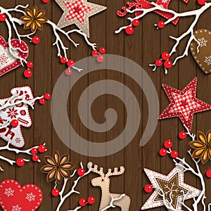 Abstract christmas background, dry branches with red berries and small scandinavian styled decorations lying on wooden
