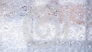Abstract, Christmas background. Winter background, natural frosty pattern on window. Frosted glass, ice texture.