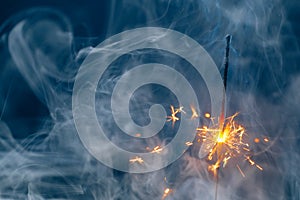 Abstract Christmas sparkler firework copy-space background with smoke