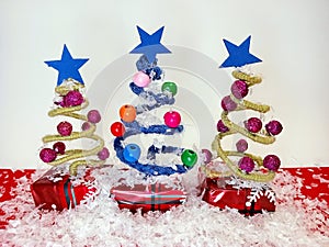 Abstract Christmas trees on a white and red background with snow