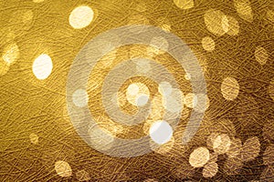 Abstract circle gold bokeh on background texture.