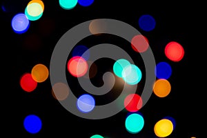 Abstract circular bokeh background of colorful Christmaslights in the dark
