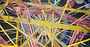 Abstract close up of carnival ride lit up at night