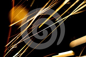 Abstract close-up image of blurred sparks and smoke from arc welding with bokeh effect