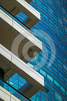 Abstract close-up of a modern glass building with reflective windows
