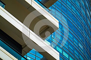 Abstract close-up of a modern glass building with reflective windows