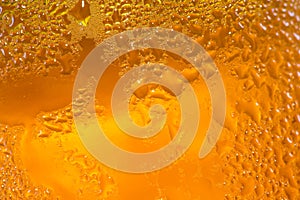 Abstract close up shot of backlit condensation on beer bottle /