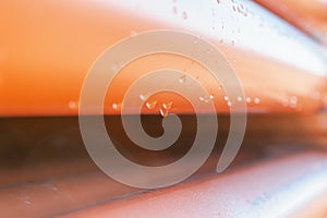 Abstract close up of a stack of orange plastic pipes on construction