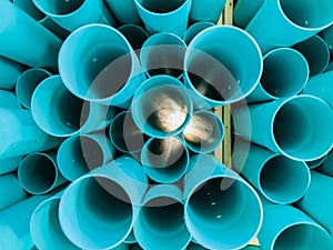 Abstract closeup detailed view of blue industrial plastic communication pipes, tubes